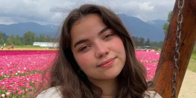 Portrait of actress Genea Charpentier smiling confidently, showcasing her youthful charm and rising presence in film and television.