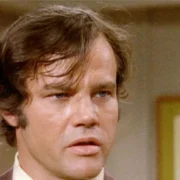 Joe Don Baker Net Worth-vintage photo of the actor in a classic film setting, reflecting his successful Hollywood career.