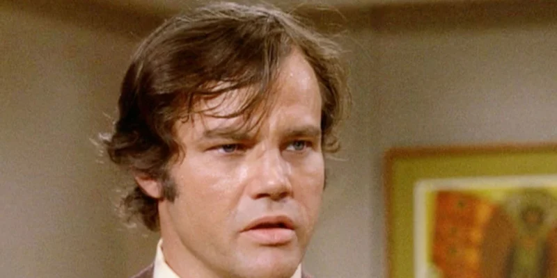 Joe Don Baker Net Worth-vintage photo of the actor in a classic film setting, reflecting his successful Hollywood career.