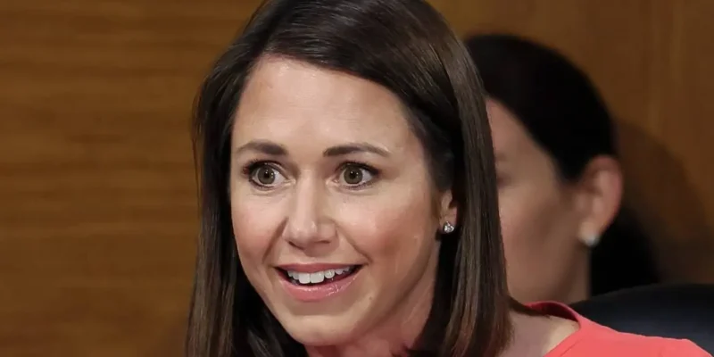 Katie Britt smiling in professional attire during Senate committee hearing - Alabama Senator with $4.5 million net worth