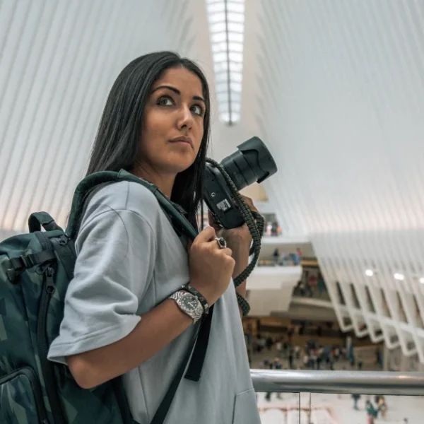 Natalie Amrossi - renowned aerial photographer shooting New York City from helicopter view.