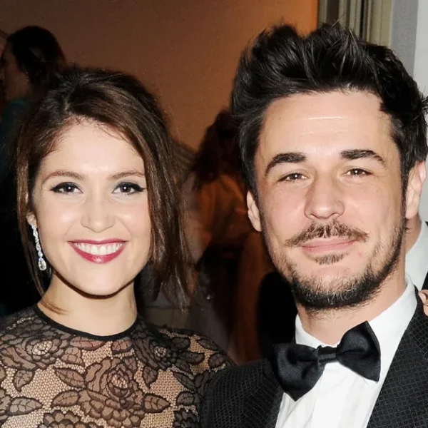 Stefano Catelli attending a formal event in a tuxedo, showcasing his style and presence in the fashion industry.