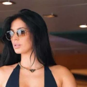 Camilla Araujo in stylish sunglasses and black outfit, luxury lifestyle linked to camilla araujo net worth.