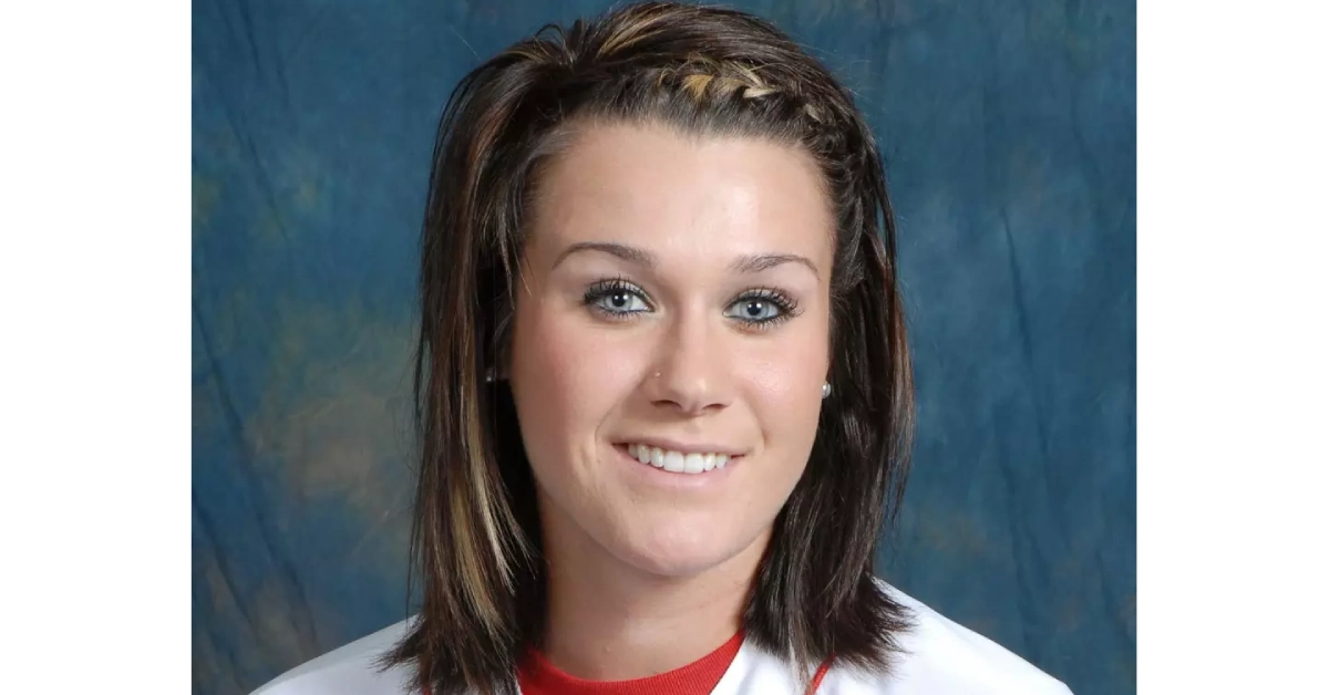 Portrait of Ashley Frost with braided hair against blue background - Scott Frost's wife in her younger years