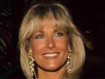 Alexis Maas smiling at a formal event, showcasing her elegant style and grace, reflecting her intriguing life story.