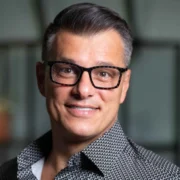 Professional business executive representing Anderson Frank, the specialized NetSuite recruitment agency connecting talent with leading companies worldwide