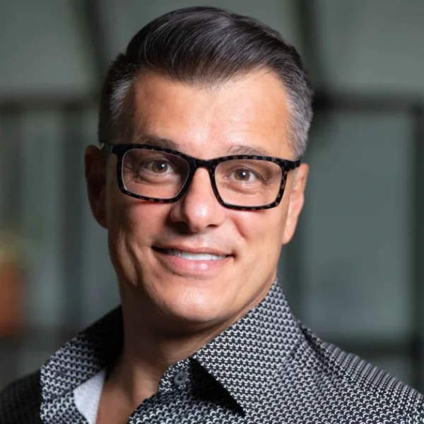 Professional business executive representing Anderson Frank, the specialized NetSuite recruitment agency connecting talent with leading companies worldwide