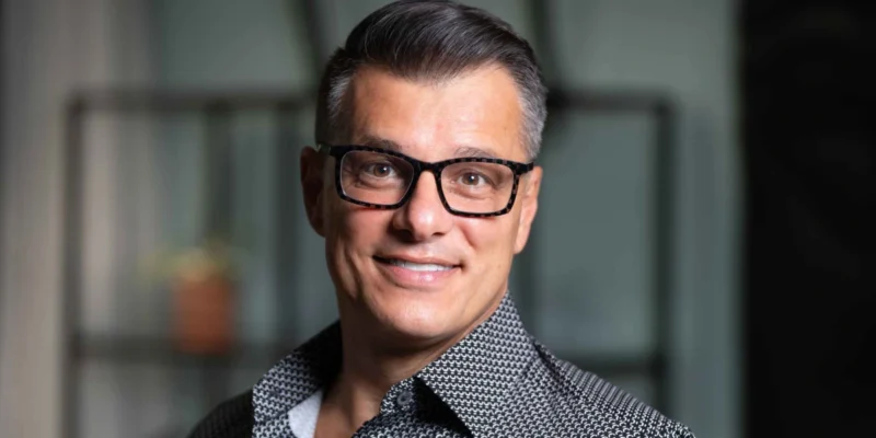Professional business executive representing Anderson Frank, the specialized NetSuite recruitment agency connecting talent with leading companies worldwide