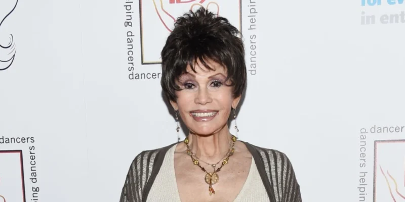 Barbara Edwards attending a charity event, elegantly dressed with layered necklaces, representing her influential presence in the industry.