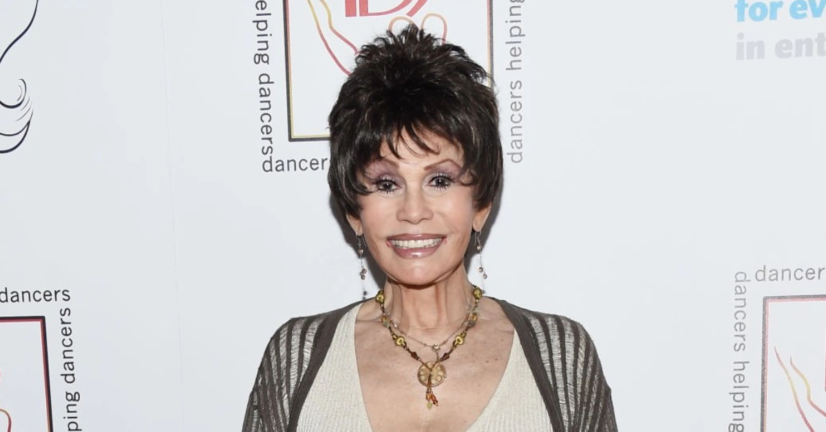 Barbara Edwards attending a charity event, elegantly dressed with layered necklaces, representing her influential presence in the industry.