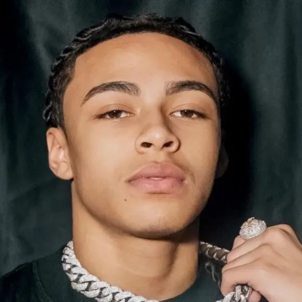 DD Osama wearing diamond chain showing his net worth success as young rapper