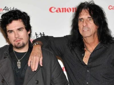 Dash Cooper standing with his father Alice Cooper at a charity event, showcasing the rock music legacy passing between generationsRetryClaude can make mistakes. Please double-check responses.