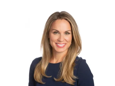 Nicole Saphier speaking at a medical conference, highlighting her role as a breast radiologist and cancer detection expert.