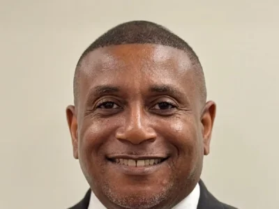 Rodney Tyson professional headshot - corporate executive and education leader smiling in business suit