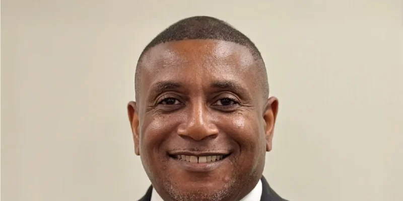 Rodney Tyson professional headshot - corporate executive and education leader smiling in business suit