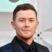 Scott Mccreery Net Worth: Country star Scott McCreery smiling at an awards event, symbolizing his musical success and financial achievements.