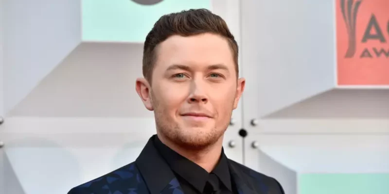 Scott Mccreery Net Worth: Country star Scott McCreery smiling at an awards event, symbolizing his musical success and financial achievements.